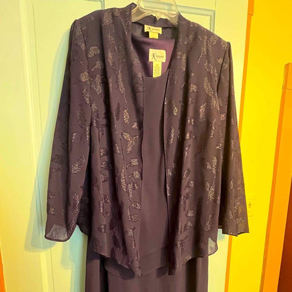 Dress is sleeveless has a light sheer jacket the has sparkly swirls.